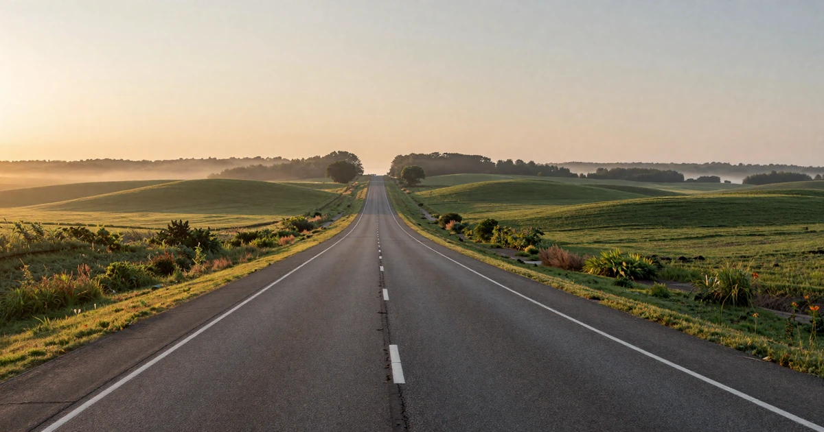 Interstate 70 Ohio highway at dawn with rolling green hills and morning mist - trucker dating Ohio backdrop